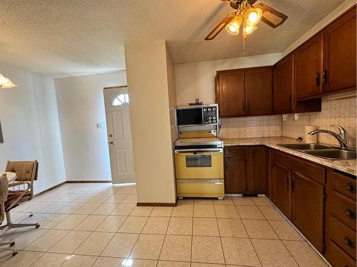 5902 55 Avenue, Red Deer, AB - Indoor Photo Showing Kitchen With Double Sink