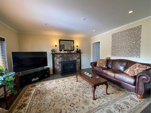 5102 54 Avenue, Ponoka, AB - Indoor Photo Showing Living Room With Fireplace