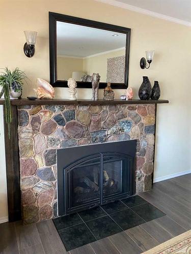 5102 54 Avenue, Ponoka, AB - Indoor Photo Showing Living Room With Fireplace