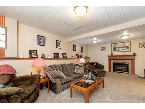 47 Elder Street, Red Deer, AB - Indoor Photo Showing Living Room With Fireplace