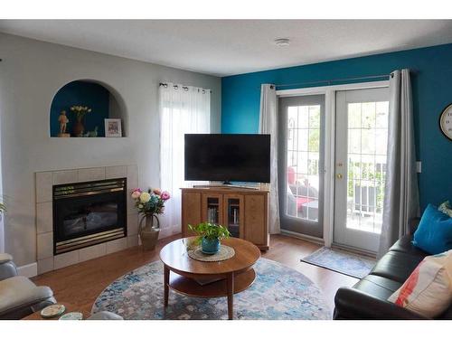 16B-32 Daines Avenue, Red Deer, AB - Indoor Photo Showing Living Room With Fireplace