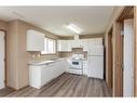 573-100 Jordan Parkway, Red Deer, AB  - Indoor Photo Showing Kitchen With Double Sink 