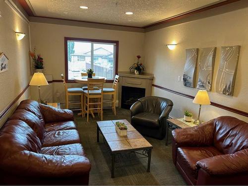 113-18 Averill Street, Red Deer, AB - Indoor Photo Showing Living Room With Fireplace