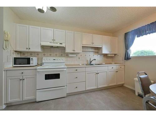 14 Ovington Close, Red Deer, AB - Indoor Photo Showing Kitchen With Double Sink