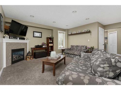 5606 28A Avenue, Camrose, AB - Indoor Photo Showing Living Room With Fireplace