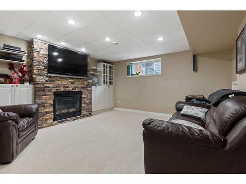 5606 28A Avenue, Camrose, AB - Indoor Photo Showing Basement With Fireplace