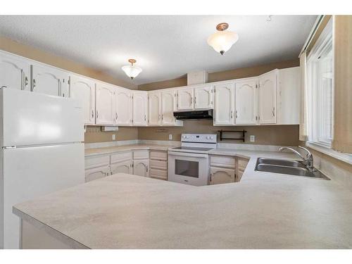 48 Nyman Crescent, Red Deer, AB - Indoor Photo Showing Kitchen With Double Sink