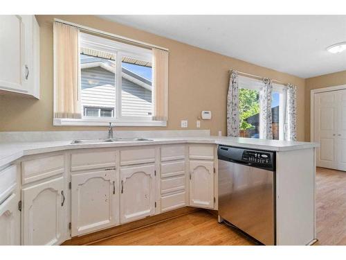 48 Nyman Crescent, Red Deer, AB - Indoor Photo Showing Kitchen With Double Sink