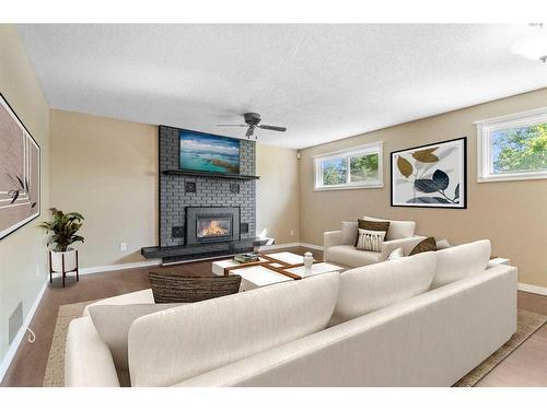 48 Nyman Crescent, Red Deer, AB - Indoor Photo Showing Living Room With Fireplace