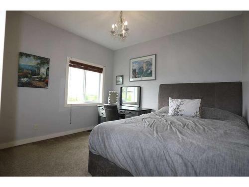 32015 292 Avenue East, De Winton, AB - Indoor Photo Showing Bedroom