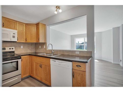 52 Terrace Heights Drive, Lacombe, AB - Indoor Photo Showing Kitchen With Double Sink