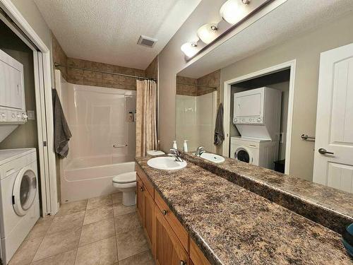 103-1600 Main Street Sw, Slave Lake, AB - Indoor Photo Showing Laundry Room