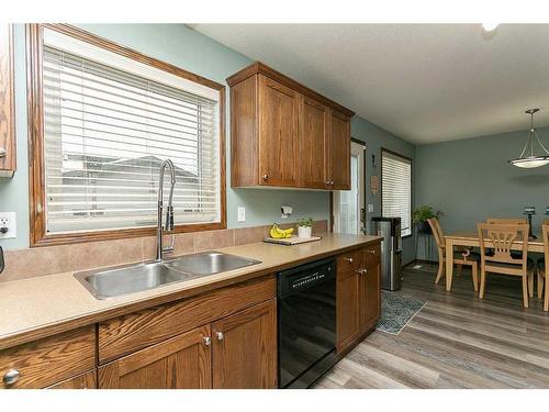 36 Hunter Road, Sylvan Lake, AB - Indoor Photo Showing Kitchen With Double Sink