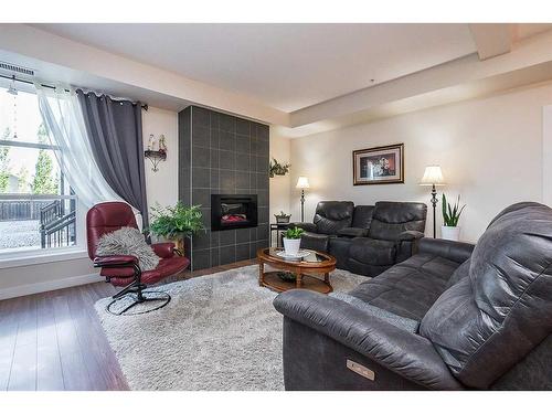 5112-2660 22 Street, Red Deer, AB - Indoor Photo Showing Living Room With Fireplace