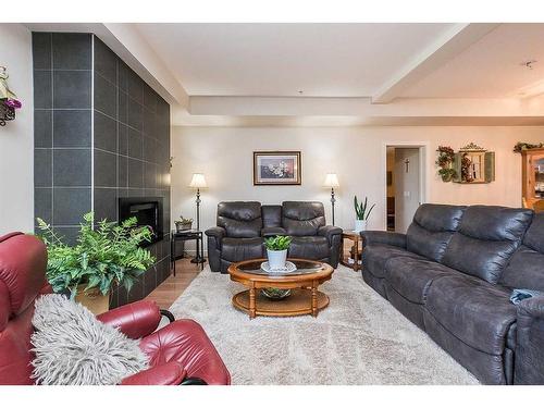 5112-2660 22 Street, Red Deer, AB - Indoor Photo Showing Living Room With Fireplace