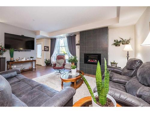 5112-2660 22 Street, Red Deer, AB - Indoor Photo Showing Living Room With Fireplace