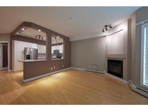 126-5300 48 Street, Red Deer, AB - Indoor With Fireplace