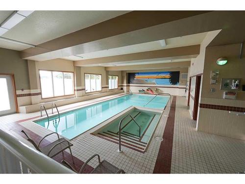 126-5300 48 Street, Red Deer, AB - Indoor Photo Showing Other Room With In Ground Pool