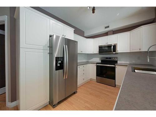 126-5300 48 Street, Red Deer, AB - Indoor Photo Showing Kitchen With Stainless Steel Kitchen With Double Sink