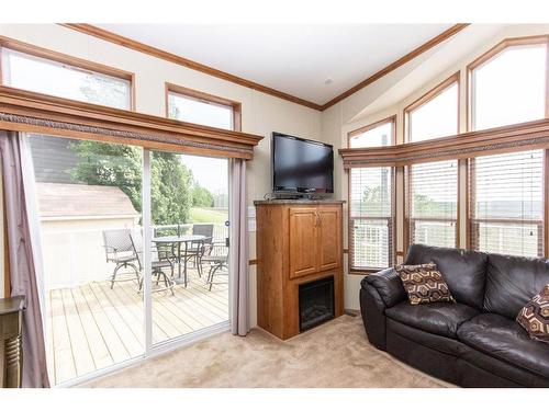 5027-25054 South Pine Lake Road, Rural Red Deer County, AB - Indoor Photo Showing Living Room With Fireplace