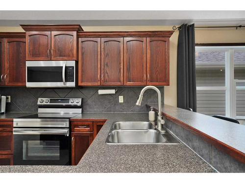 124 Ireland Crescent, Red Deer, AB - Indoor Photo Showing Kitchen With Double Sink