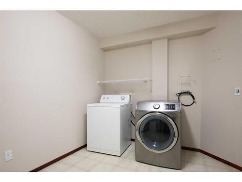 32 Fern Glade Crescent, Sylvan Lake, AB - Indoor Photo Showing Laundry Room