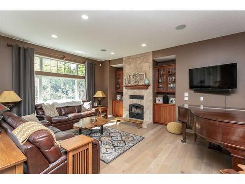 3-421022 Range Road 260, Rural Ponoka County, AB - Indoor Photo Showing Living Room With Fireplace