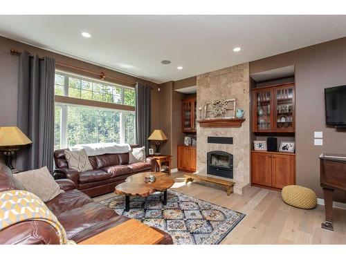 3-421022 Range Road 260, Rural Ponoka County, AB - Indoor Photo Showing Living Room With Fireplace