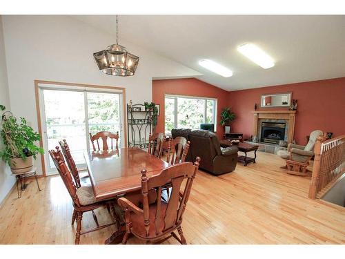 4631 48 Street, Red Deer, AB - Indoor Photo Showing Dining Room With Fireplace