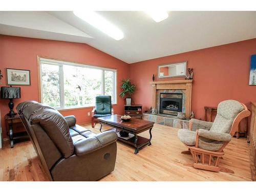 4631 48 Street, Red Deer, AB - Indoor Photo Showing Living Room With Fireplace