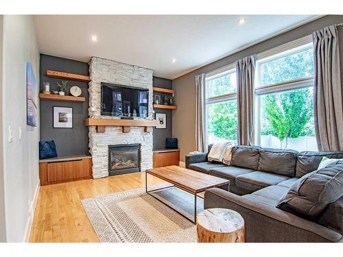 115 Issard Close, Red Deer, AB - Indoor Photo Showing Living Room With Fireplace