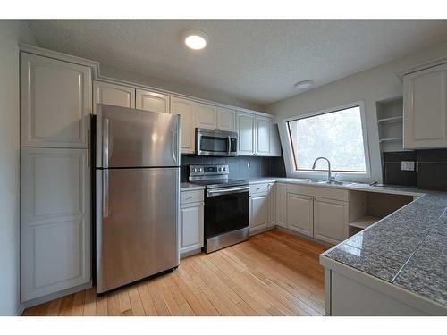 27 Barner Avenue, Red Deer, AB - Indoor Photo Showing Kitchen With Double Sink