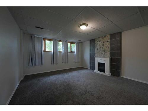 27 Barner Avenue, Red Deer, AB - Indoor Photo Showing Other Room With Fireplace
