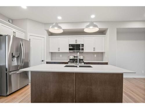 27 Gray Close, Sylvan Lake, AB - Indoor Photo Showing Kitchen With Upgraded Kitchen