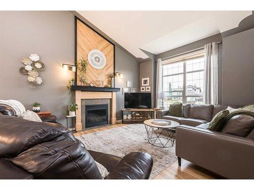 45 Firdale Court, Sylvan Lake, AB - Indoor Photo Showing Living Room With Fireplace