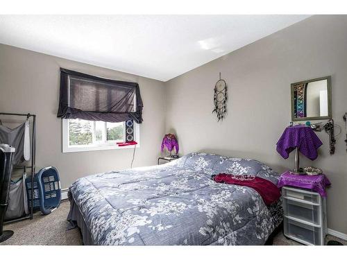 101-304-6821 59 Avenue, Red Deer, AB - Indoor Photo Showing Bedroom