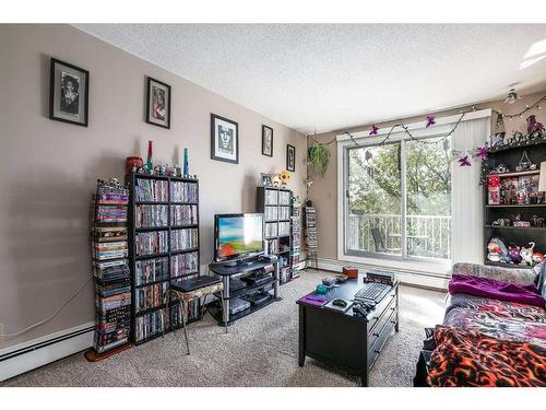 101-304-6821 59 Avenue, Red Deer, AB - Indoor Photo Showing Living Room