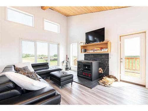 23307 394 Township Ne, Rural Lacombe County, AB - Indoor Photo Showing Living Room With Fireplace