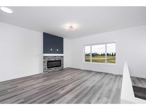 15-6519 46 Street West, Wetaskiwin, AB - Indoor Photo Showing Living Room With Fireplace