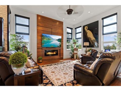 57 Lazaro Close, Red Deer, AB - Indoor Photo Showing Living Room With Fireplace