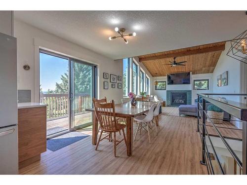 74-37535 Range Road 265, Rural Red Deer County, AB - Indoor Photo Showing Dining Room With Fireplace