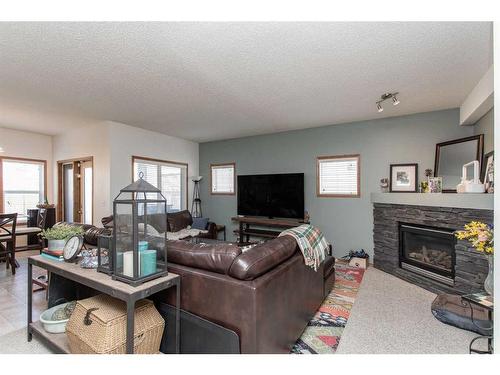 19 Jones Crescent, Red Deer, AB - Indoor Photo Showing Living Room With Fireplace