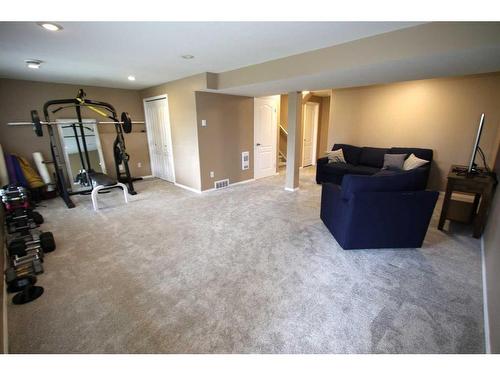 32 Arnold Close, Red Deer, AB - Indoor Photo Showing Gym Room