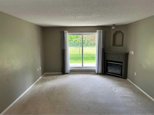 122-18 Averill Street, Red Deer, AB - Indoor With Fireplace