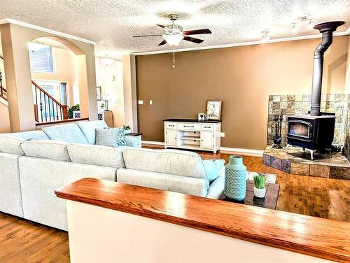 1865 Barton Drive Sw, Slave Lake, AB - Indoor Photo Showing Living Room With Fireplace