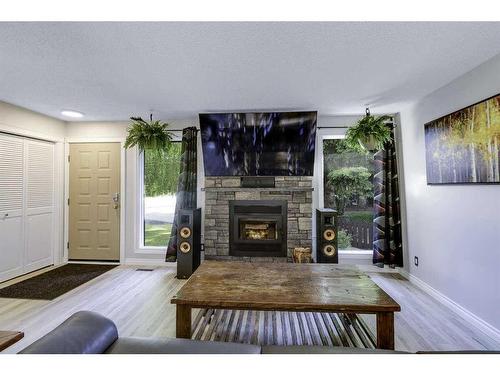 11 Glenbrook Place, Cochrane, AB - Indoor Photo Showing Living Room With Fireplace