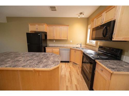 38-45 Ironstone Drive, Red Deer, AB - Indoor Photo Showing Kitchen With Double Sink