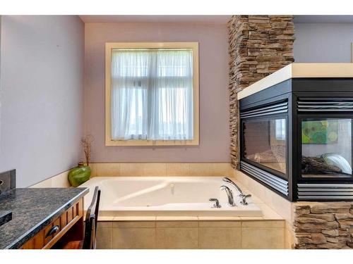 34202 Range Road 13, Rural Red Deer County, AB - Indoor Photo Showing Bathroom With Fireplace