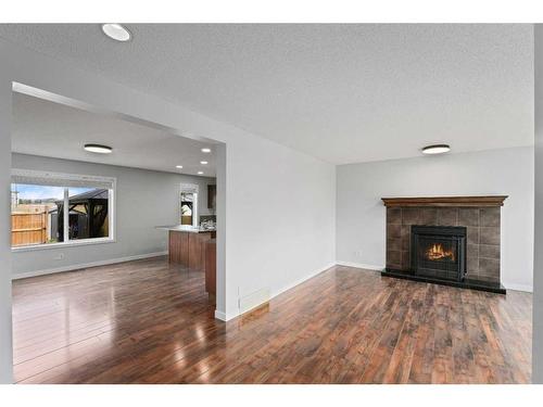 375 Prestwick Close Se, Calgary, AB - Indoor Photo Showing Living Room With Fireplace