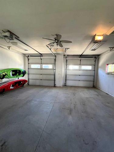 23 Lodge Place, Sylvan Lake, AB - Indoor Photo Showing Garage